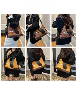 Dettaglio della borsa tote a forma di cane indossata in vari stili da una modella in interno