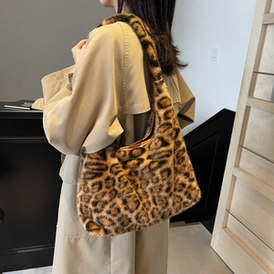 Faux fur leopard print hobo bag worn over shoulder with autumn trench coat outfit