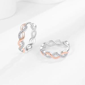Twisted two-tone hoop earrings with silver and rose gold finish and pavé cubic zirconia