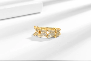 Macro view of golden double-layer butterfly ring featuring zircon-encrusted wings