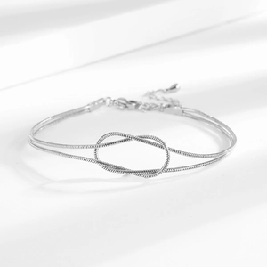 Double-layered snake bone knot bracelet in silver finish with adjustable lobster clasp