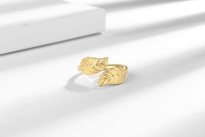 Detailed view of 18K gold plated leaf ring showing intricate texture and open design