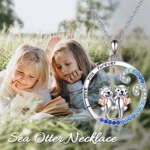 Cute sea otter pendant necklace with blue gradient crystals and heart details
