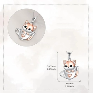 Detailed view of silver fox cup pendant with rose gold accents and size measurements