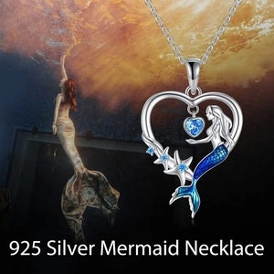 Detailed view of silver mermaid necklace with blue gradient tail and heart gemstone