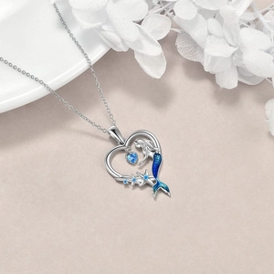 Blue mermaid and starfish pendant necklace in silver with heart-shaped ocean theme design