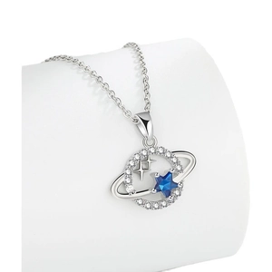 Silver planet necklace with sparkling blue star pendant and micro-set crystal orbital ring