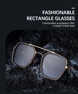 Detailed macro view of square metal sunglasses with double bridge on rugged rock surface