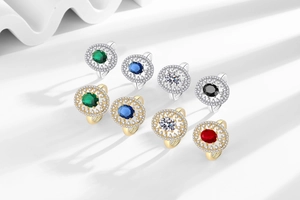Detail of an 8-piece luxury ring set featuring colorful gemstones in gold and silver finish