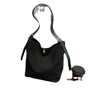 Classic black faux suede tote bag with gold metal buckle and adjustable shoulder strap