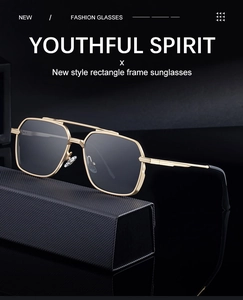 Detail of square frame sunglasses with double bridge and carbon fiber style case