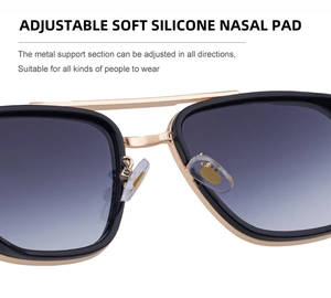 Détail des plaquettes de nez en silicone souple sur lunettes carrées rétro avec pont métallique