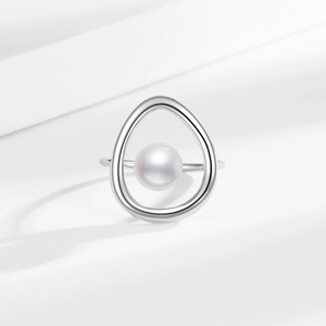 Minimalist silver geometric ring with a white pearl in a sleek asymmetrical frame