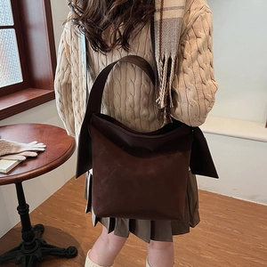 Minimalist deep brown matte leather bucket bag for women with wide strap and large capacity