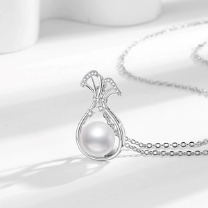 Elegant freshwater pearl pendant necklace in money bag design with sparkling zircon bow