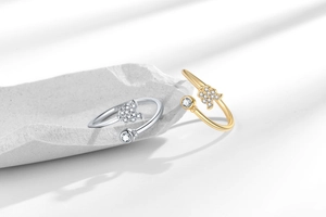 Detailed view of S925 sterling silver stamp on butterfly ring with zircon accents