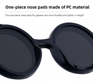 Detail of high-quality PC frame showing lightweight one-piece nose pads on black sunglasses