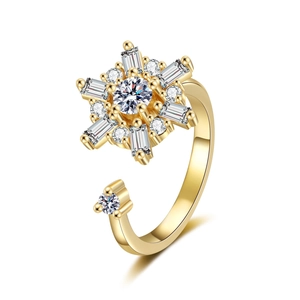 Rotating snowflake fidget ring with zircon stones on an adjustable gold metal band