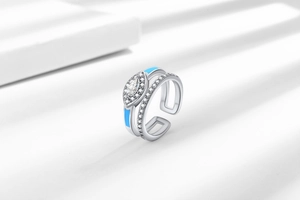 Macro shot of silver-toned double layer ring with blue enamel and marquise cubic zirconia
