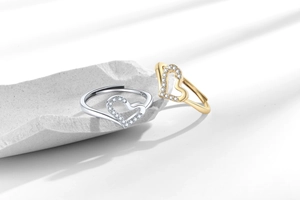 Detailed close-up of S925 sterling silver heart rings with pavé zircon setting