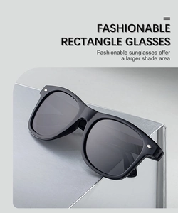 Close-up of black square polarized sunglasses with silver dot metal accents on the frame