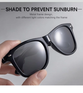 Detailed close-up of square sunglasses featuring metal hinge accents and grey lenses