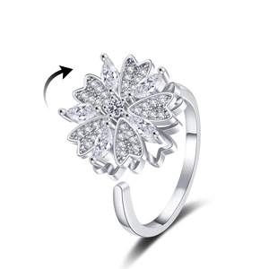Rotating four-leaf clover flower ring with white zircons in adjustable silver finish