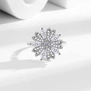 Elegant rotating flower ring in S925 silver with cubic zirconia and heart petals