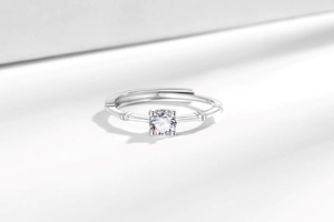 Macro detail of adjustable bamboo joint ring with sparkling round cut diamond-like stone