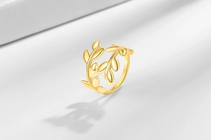 Detailed view of polished 18K gold plated brass clover leaf ring with adjustable opening