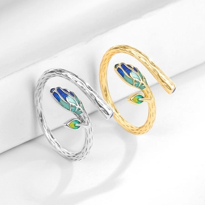 Minimalist vine leaf open rings with blue and green enamel buds in silver and gold