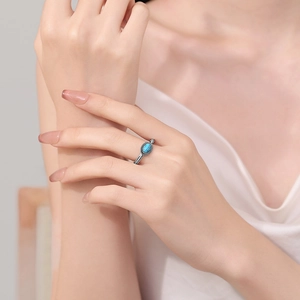 Retro turquoise ring for women featuring a blue oval stone and bohemian silver engraving