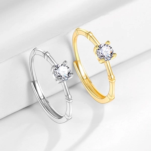 Bamboo style moissanite engagement ring set in silver and gold finish for couples