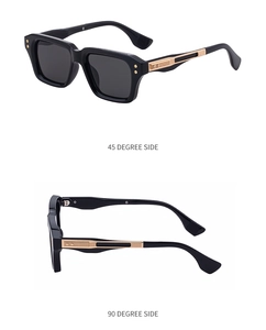 Detail view of square sunglasses with gold metal stripe accents and rivet hinge design