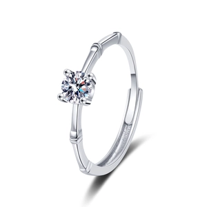 Bamboo style adjustable silver ring featuring a sparkling moissanite solitaire stone