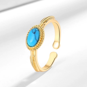 Vintage bohemian gold adjustable ring featuring an oval blue turquoise gemstone center
