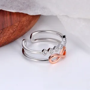 Detailed close-up of double-layer infinity ring with rose gold plating and zircon inlay
