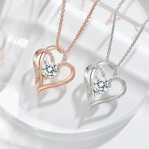 Double heart pendant necklaces in silver and rose gold finishes with crystal inlay