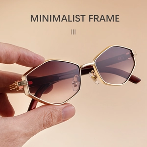Detailed macro of gold geometric polygon sunglasses with gradient brown lenses