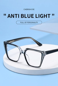 Close-up of cat-eye frames with anti-blue light lenses on a clean podium