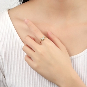 Rotating butterfly ring with micro-pave zircons and twisted gold band on model