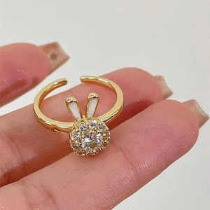 Adjustable golden rabbit ear ring with sparkling zircon stones and enamel bunny ears
