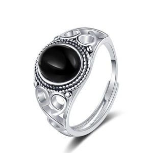 Vintage silver adjustable ring with oval black onyx gemstone and hollow out pattern