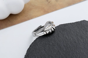 Macro detail of silver fidget ring with sparkling pavé cubic zirconia and movable beads