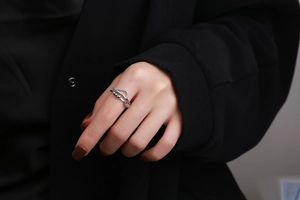 Detail of silver double-layered ring with sparkling cubic zirconia and moving metal beads