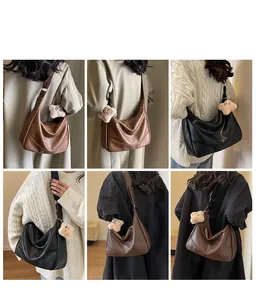 Detailed views of high-capacity crescent hobo bags in brown and black on a model