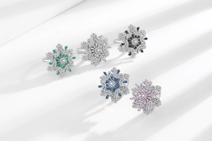 Macro detail of snowflake rings featuring colorful baguette stones and pave setting