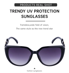 Close-up of golden hollow metal decoration on trendy black cat eye sunglasses frames