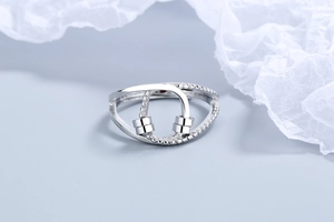 Macro shot of silver fidget ring with sliding beads and polished asymmetrical band