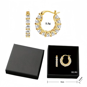 Macro detail of U-shaped gold earrings with zircon pavé setting and size specifications